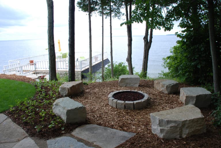 Stone fire pit next to the bay.