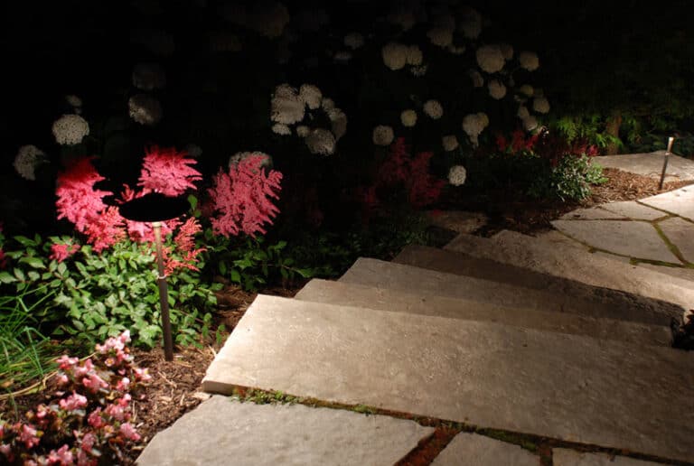 Outdoor lighting - surrounded by flowers.