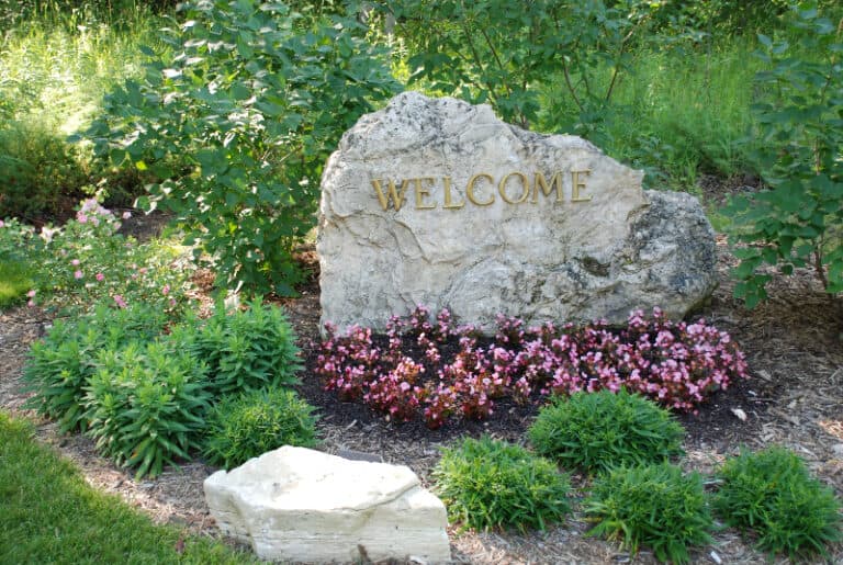 Stone boulder that says "Welcome"