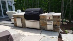 Stone wall with built in grill and appliances.